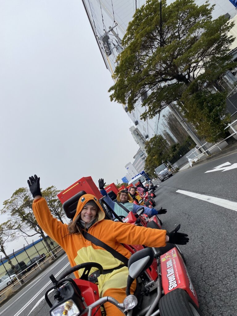 street kart tour in costumes as group poses